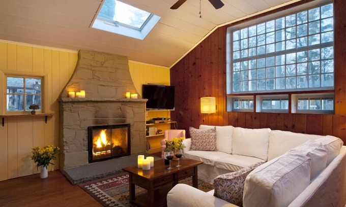 Woodstock House | Brookside Retreat: streamside patio outdoor fireplace fenced yard walk to town!