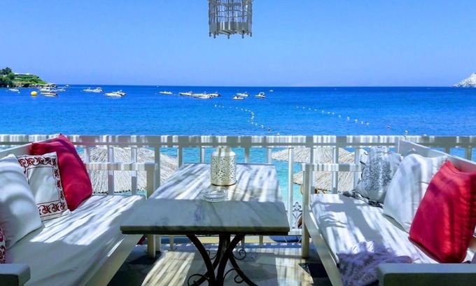 Agia Pelagia House | By the Sea beachfront luxury apartment with a large patio