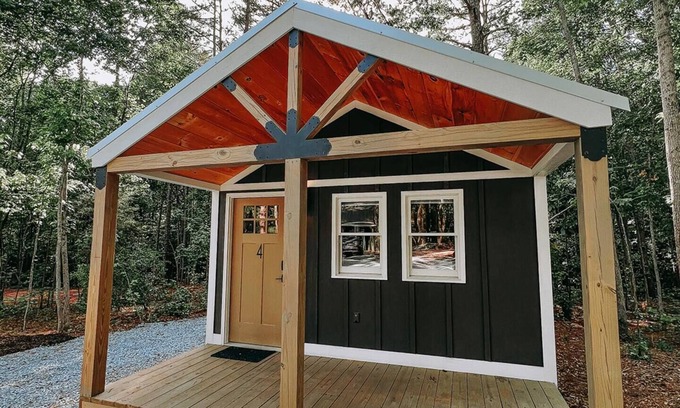 Hartwell RV Rental | Cabin #4: Two queen-size beds with a kitchenette and a large gravel parking pad beside the cabin for easy boat or trailer storage.