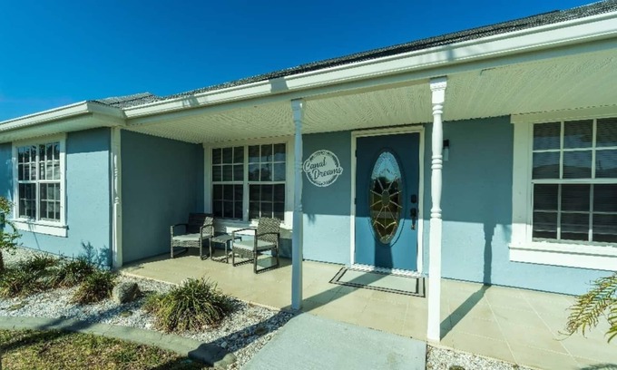 South Gulf Cove House | Canal Dreams a Gorgeous 3 BR/2 BA home with heated pool on the canal