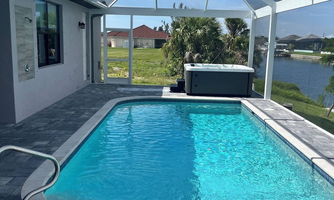 Burnt Store House | Cape Coral cozy! Pool, hot tub, outdoor kitchen, gulf access, fishing,sleeps 10