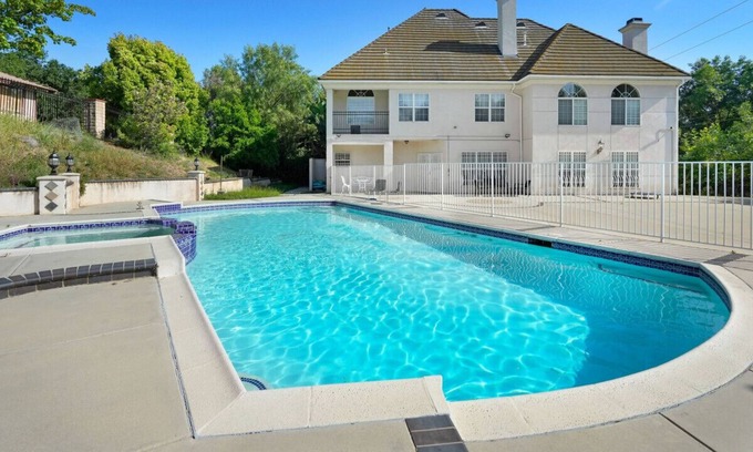 West Covina House | Captivating Chateau Getaway in Covina: 5BR Oasis with Pool, Fitness Studio, X-box Gaming, Chess, and Enchanting Gardens