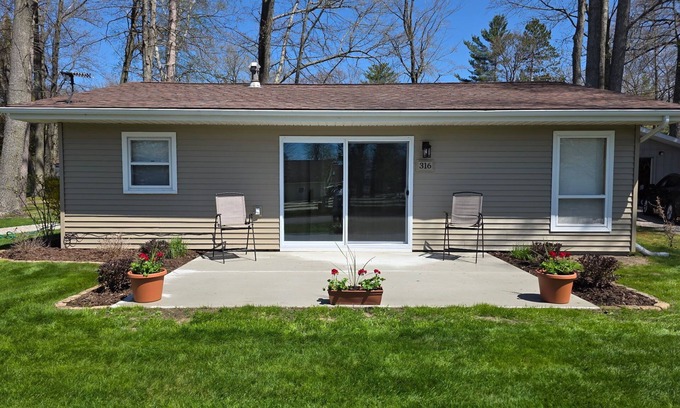 Prudenville Cottage | Centrally located, four season retreat w/firepit and lakeview.