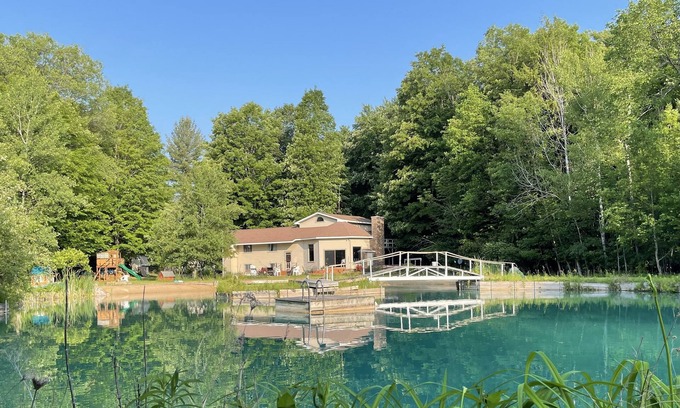 Fife Lake Ski Chalet | Chalet on Manistee River with amazing backyard pond. 5 minutes from Fife Lake.