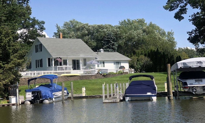 North Muskegon Cottage | CHANNELSIDE COTTAGE! Amazing views of Muskegon Lake & 10 mts from Lake Michigan!
