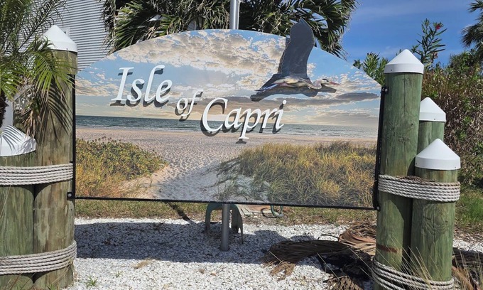 Capri Isle House | Charming 2 Bed Treasure Island Townhouse, heated community pool.