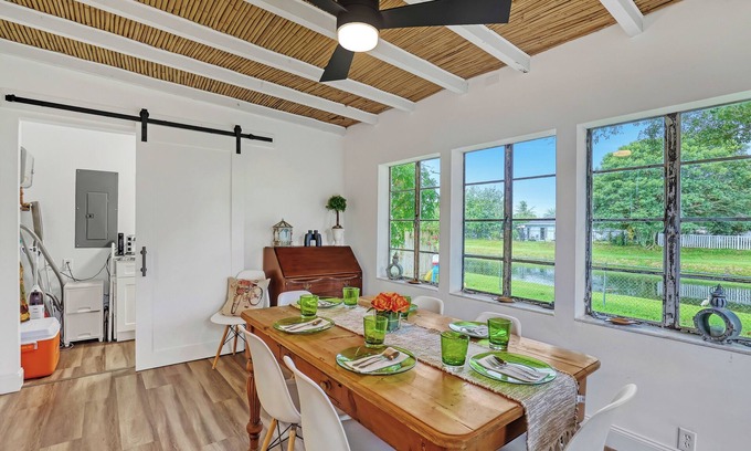 Florida North Atlantic Coast House | Charming 3BR Canal Home w/patio dining, Fire Pit & Workspace