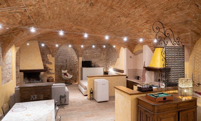 Spello Apartment | Charming brick and stone loft in a 17th-century chapel in the historic center