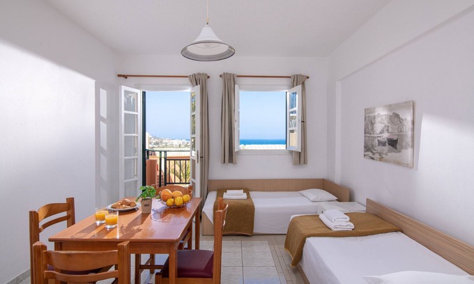 Hersonissos Centre Apartment | Charming Family Apartment with Sea View & Shared Pool