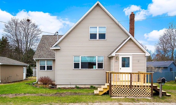 Petoskey House | Charming home with large backyard, firepit, grill, patio, and private W/D