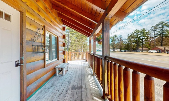 Arbor Vitae Cabin | Charming lakefront cabin with fireplace, cozy interior, streaming, & partial AC