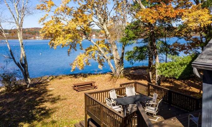 Lochmere House | Charming waterfront on Silver Lake home with a sandy beach and wraparound deck