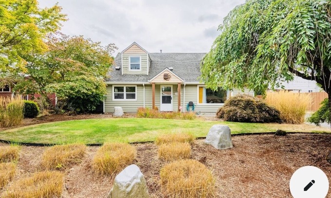 Russell House | Cheerful 4 bedroom home with fireplace!