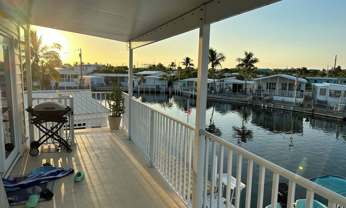 Key West House | Cheerful home with waterfront canal and boat dock on Big Coppit key- 28 day min