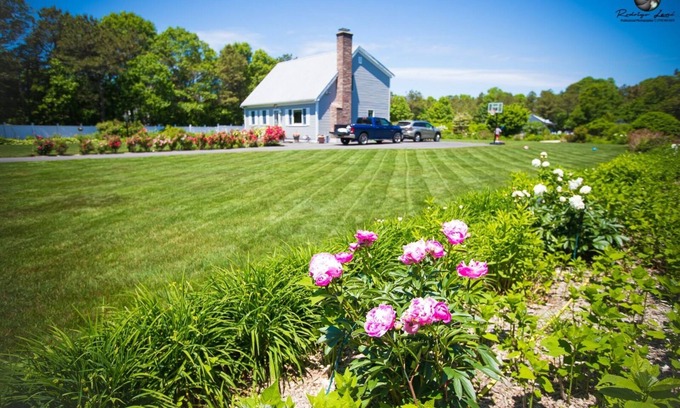 East Falmouth House | Cheerful residential home with beautiful outside area with heat swimming pool.
