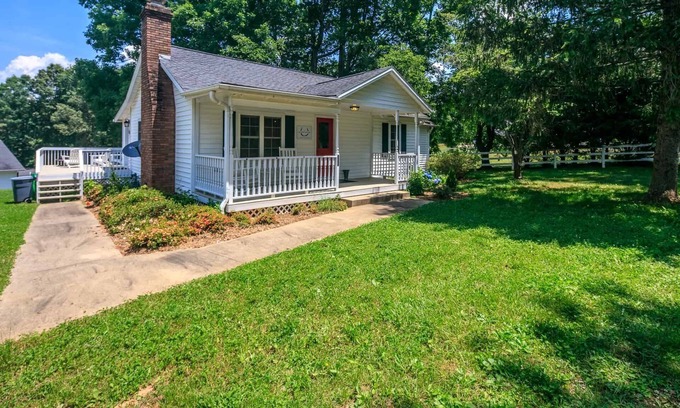 Hendersonville Cottage | Classic white farmhouse style cottage. Perfect for a serene country getaway.