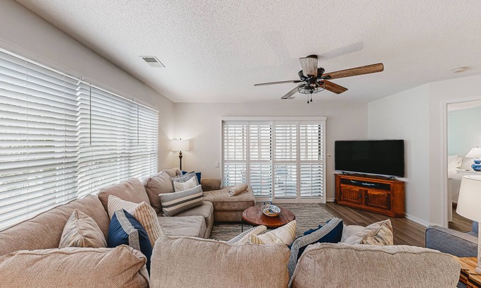 Sea Trail Condo | Coastal resort condo with on-site pools, hot tub, game room, & golf