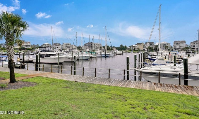 St. James Condo | Coastal Retreat - Relaxing Marina View - Minutes from Oak Island