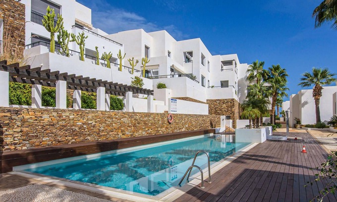 Playa Macenas Apartment | Comfortable apartment with shared pool and sea view.