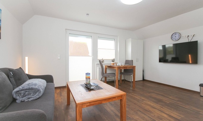 Norddeich Apartment | Comfortable vacation apartment Kranich 2 with balcony in Norddeich, close to the sea