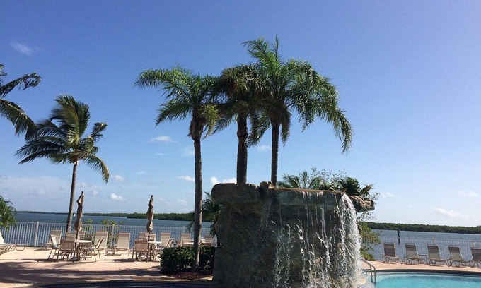 Fort Myers Beach Condo | Condo with Balcony Dining, Resort Pool, Restaurant and Gym