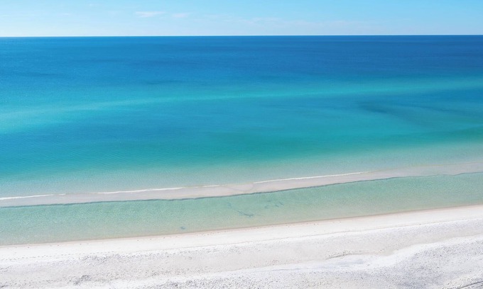 West Panama City Beach House | Convenience - Dedicated covered parking at entrance to unit, steps from beach