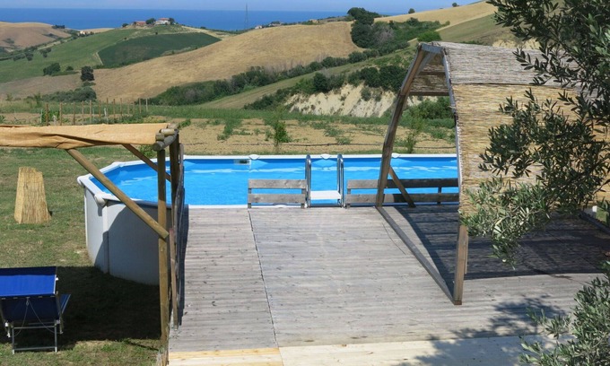Cologna Spiaggia Villa | Cosy apartment in villa with A/C, pool, hot tub, WIFI, TV, patio, pets allowed and panoramic view