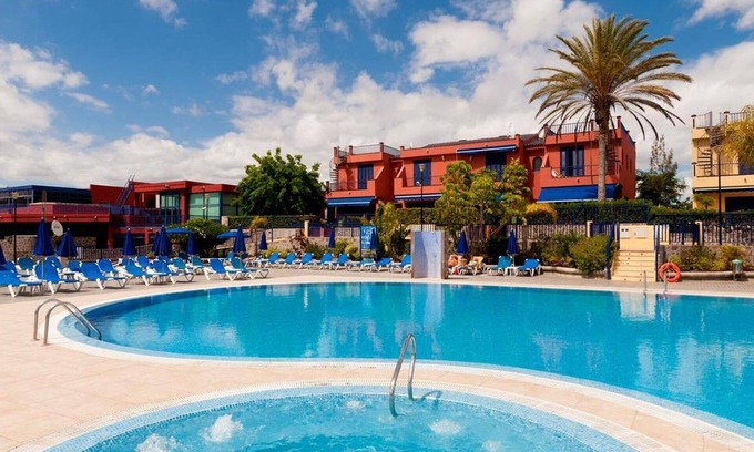 Costa Meloneras Apartment | Cosy apartment for 4 people with A/C, pool, WIFI, TV, terrace and parking
