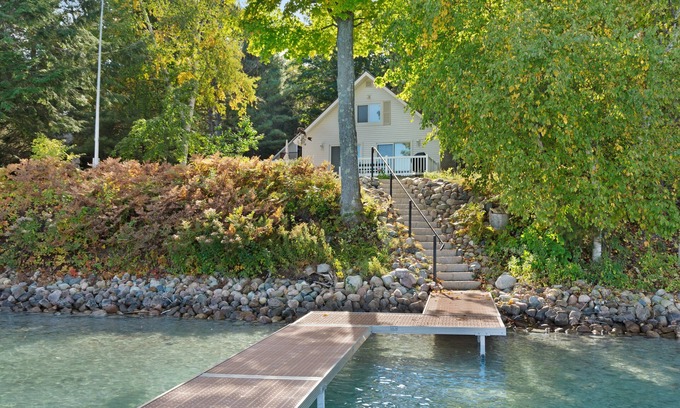 Boyne City House | Cottage with lake views, private dock & firepit - near public boat launch