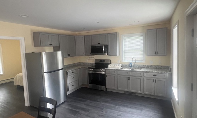 Guild Apartment | Cozy 2-bedroom apt-1 in Lakes Region with AC, WiFi, Pet friendly 2 queen beds