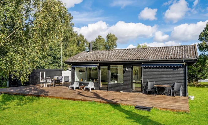 Holbaek House | Cozy cottage located on a large fenced plot.