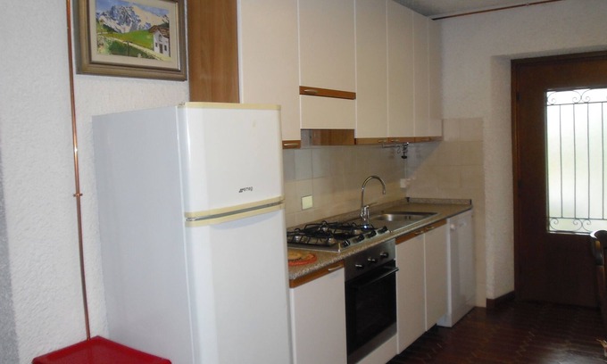 Sala Comacina House | Cozy relaxing apartment with garden and views of the lake and mountains