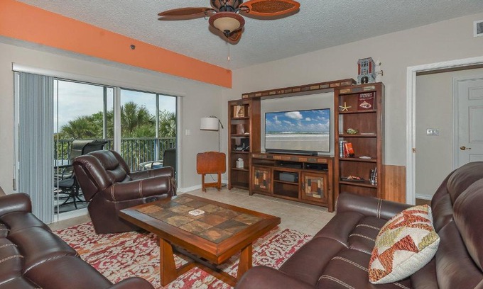 New Smyrna Beach Apartment | Cozy up in this gorgeous coastal themed 32 condo with views of the estuary OW10-303