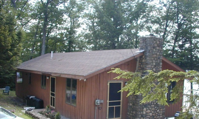 Harrison House | Cozy waterfront cottage on private land with beautiful sunsets over Long Lake