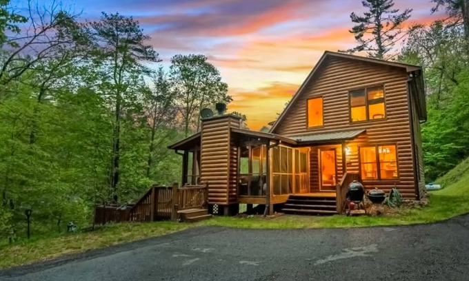 Cherry Log Cabin | Creek Cabin with fenced yard, screened in patio and hot tub