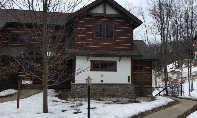 Boyne City Condo | Creekside Condo w/private hot tub at Boyne! Ski-in/Ski-out, Golf, Bike, Swim