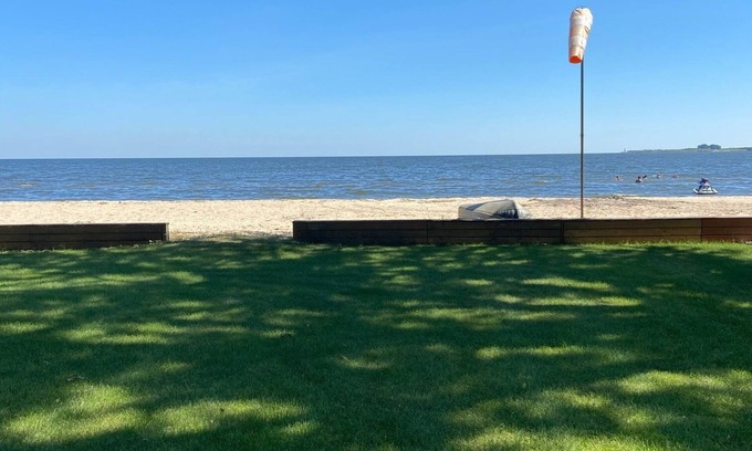 Bay City House | Cute house on Saginaw Bay with hot tub on private beach.