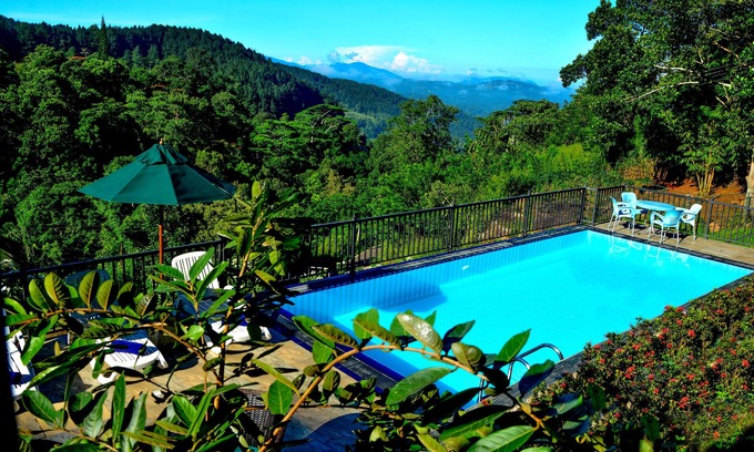 Kandy Villa | Deluxe Family room with balcony and mountain view.
