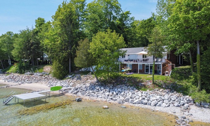 Suttons Bay House | Direct waterfront on West Grand Traverse Bay! Overlooking deck