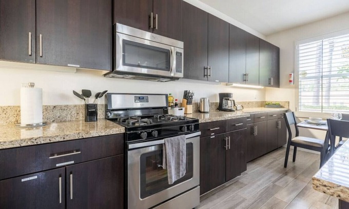 Azusa House | Discover comfort and convenience in this spacious 3-bedroom, 2.5-bathroom townhouse with king-sized beds, high-speed internet, a 2-car garage, and a prime central location.