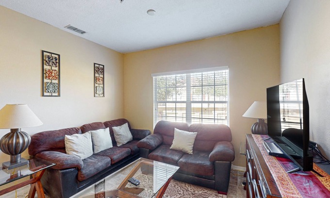 West Kissimmee Condo | Dog-friendly condo with pool, gym, tennis, & game room - close to parks