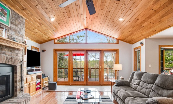Rhinelander House | Dog-friendly lakefront home with deck, lake views, grill, fireplace, patio, AC