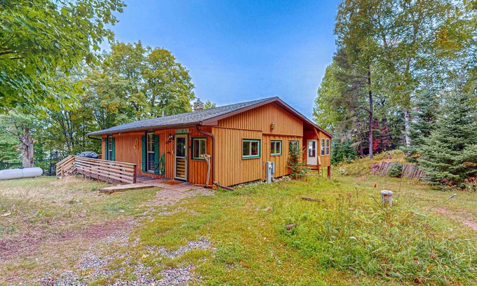Presque Isle House | Dog-friendly lakefront home with boat access, deck, fireplace, gas grill, kayaks