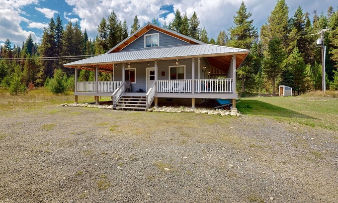 Elk City House | Dog-friendly riverfront home near town with deck, water views, & fireplace