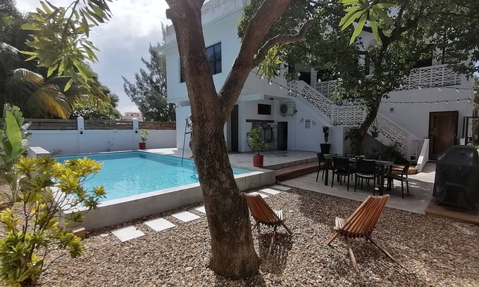 Dangriga Apartment | Downtown Dangriga! Style and comfort with a pool. Maya Mountains and sea views.