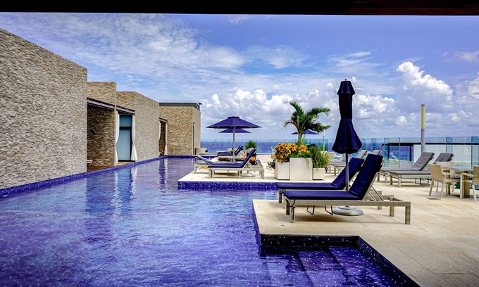 Gonzalo Guerrero Apartment | Dream getaway near the beach and city with pool, balcony, gym, fast WiFi & W/D