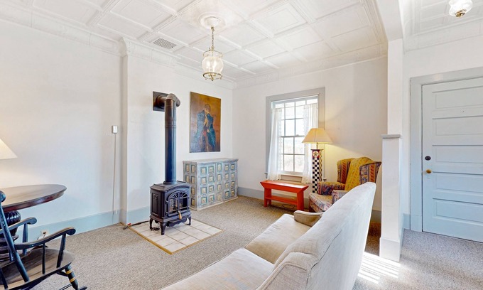 Coupeville House | Duplex cottage next to Fort Casey State Park with porch & Puget Sound view
