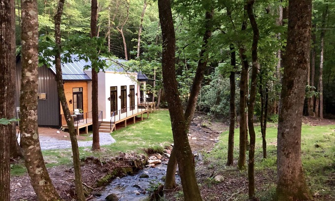 Scaly Mountain House | E Ranch is a modern, creek side, Scandinavian barnhouse.