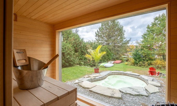 Eastman Cottage | Eastern Townships waterfront with salt-in-ground spa, sauna, pool table and wifi