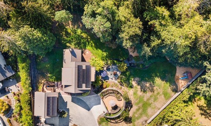 Bainbridge Island House | Eco-conscious home with private hot tub, Olympic views, gym, & play structure